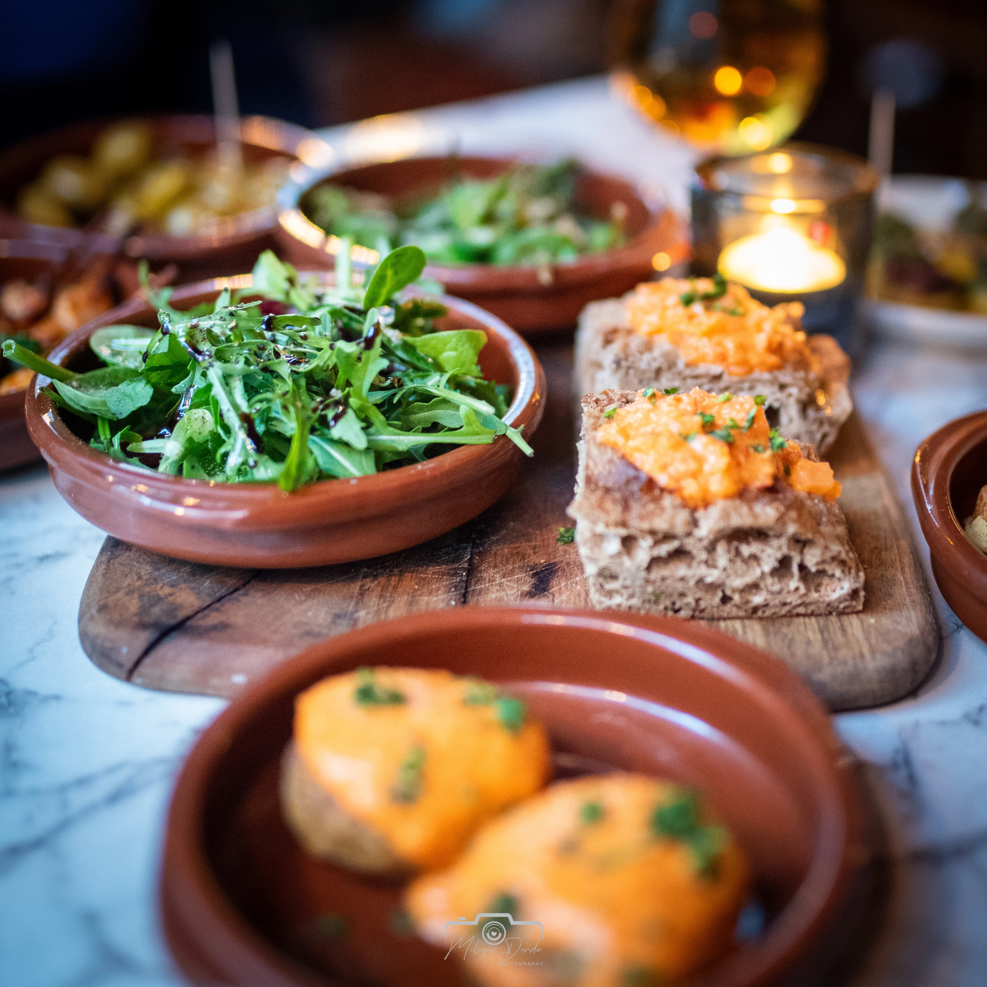 Taste-bud-tickling delights: From fresh salads to savory Montaditos, every bite at El Barcito is a journey to Madrid. Image